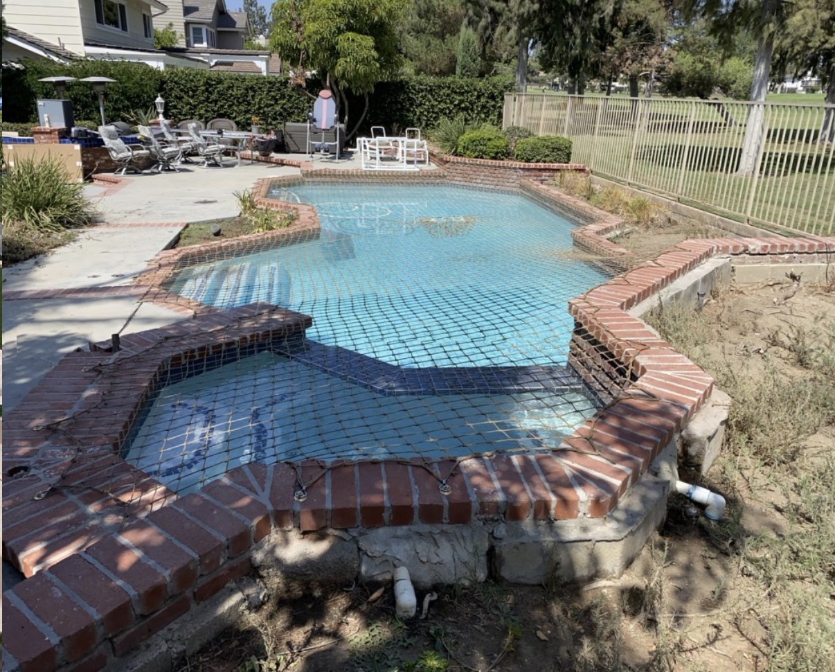 Custom safety net on brick pool