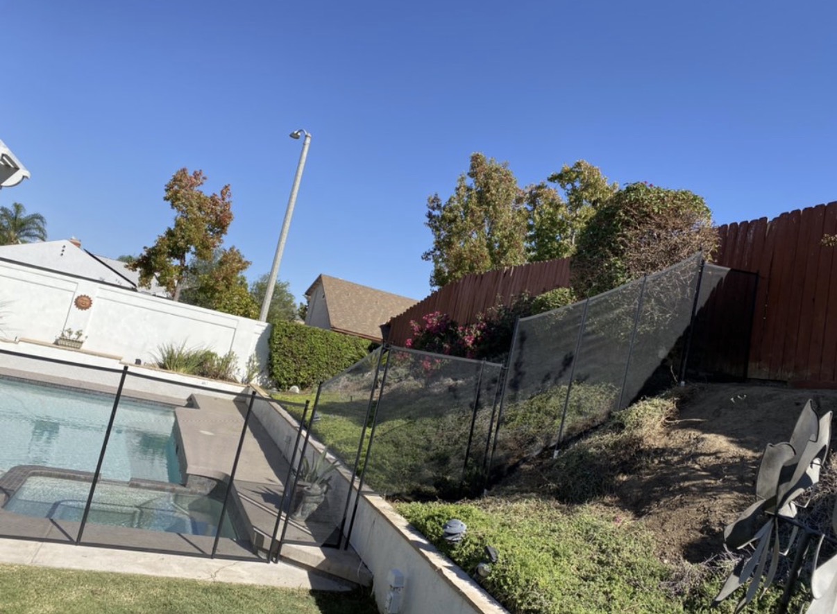 Hillside pool fence installation