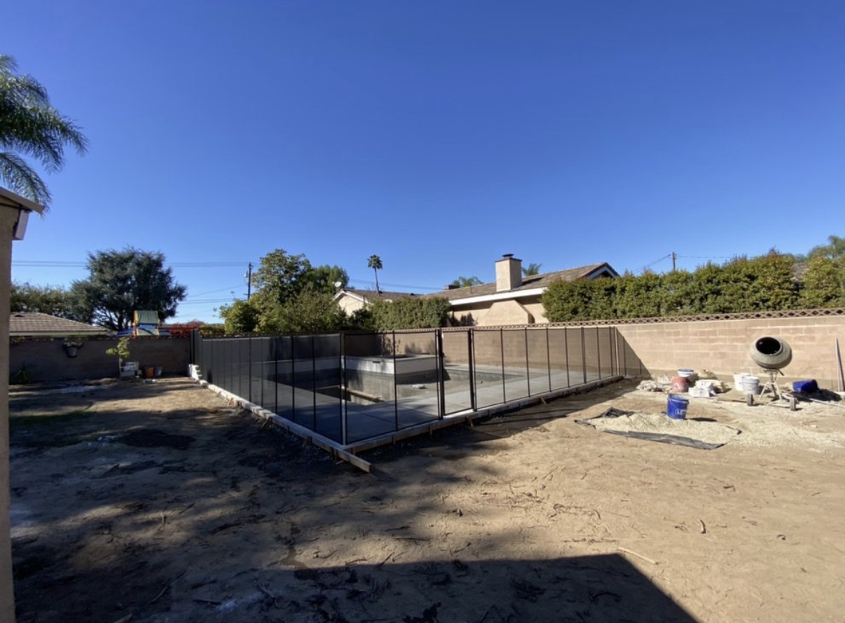 Pool safety fence under construction