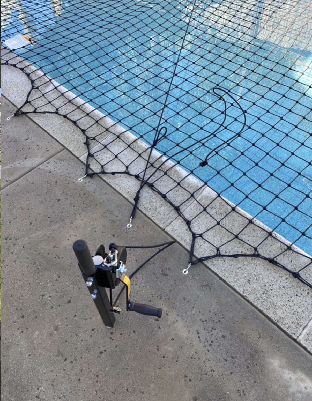 Pool safety net with installation reel