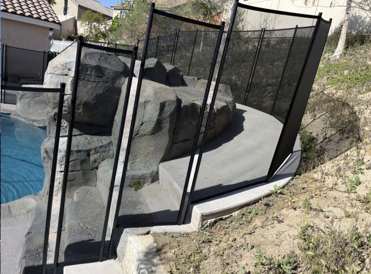 Removable fence around rock waterfall