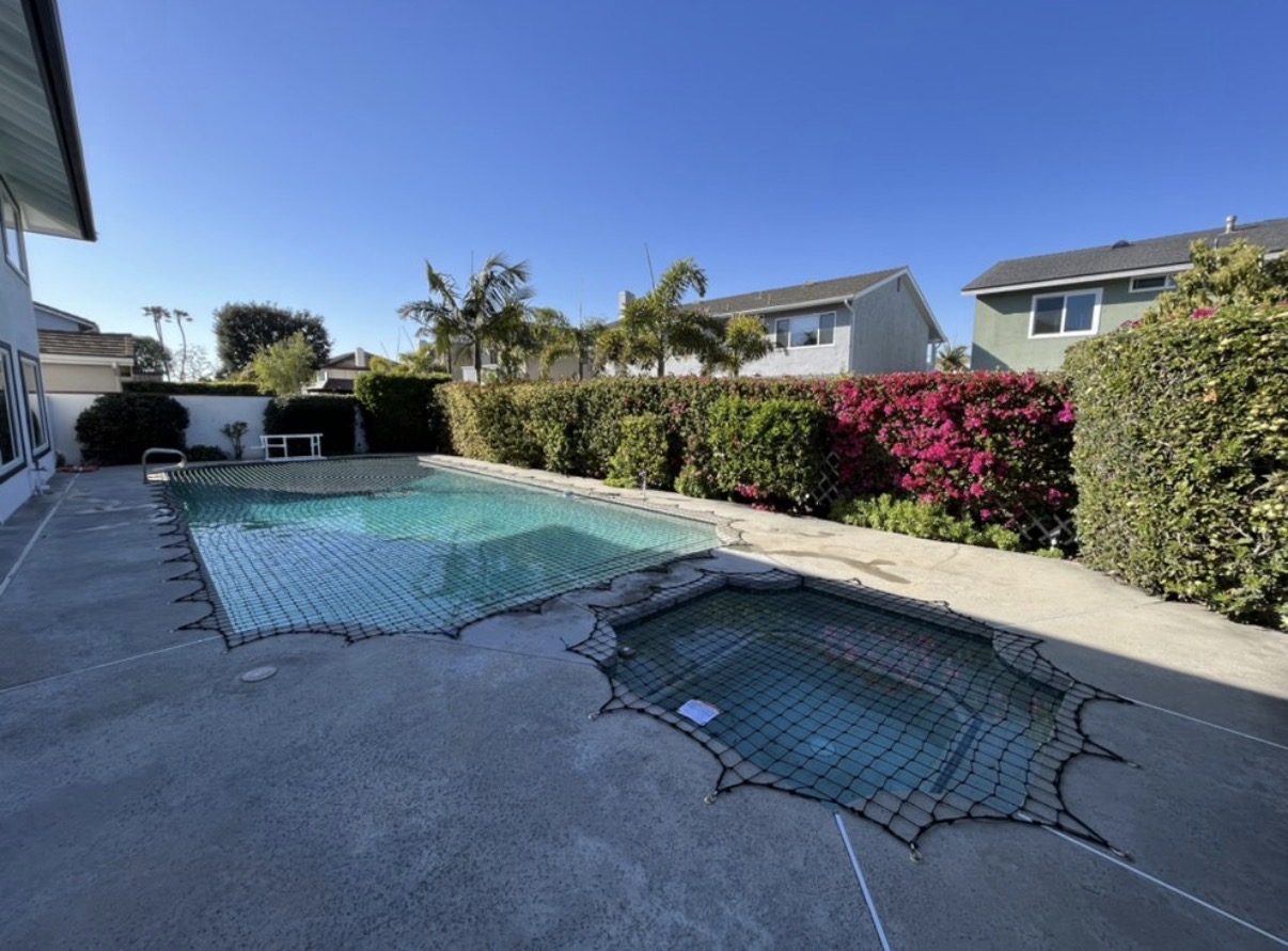 Pool and spa with custom safety net
