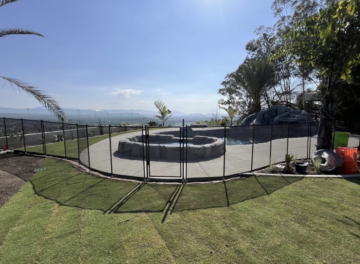 Hillside pool with panoramic view and safety fence