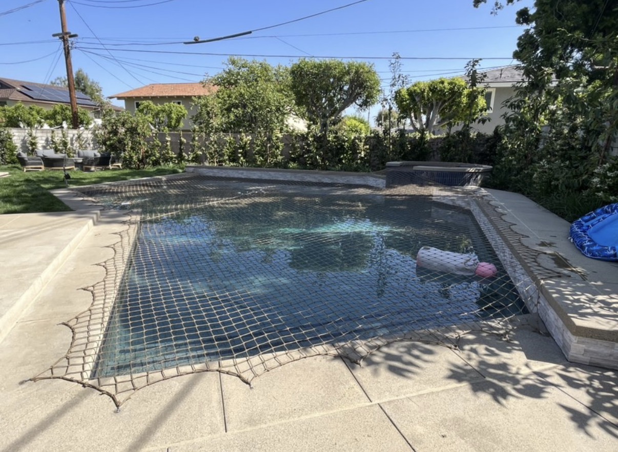 Pool and spa with tan safety net