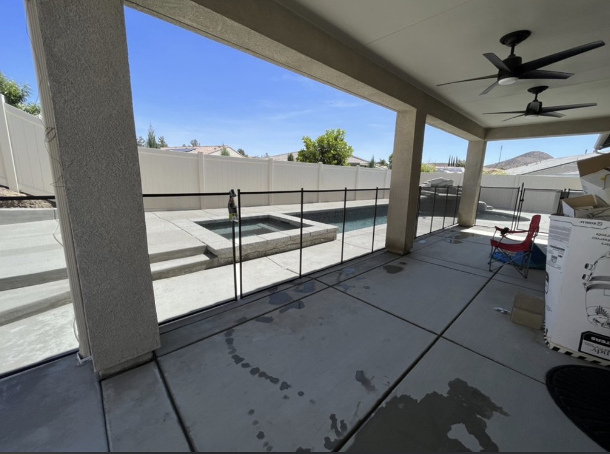 Covered patio with pool safety fence